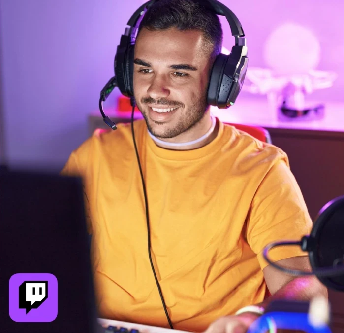 Streamer smiling while live on Twitch, exploring how to buy Twitch followers to grow faster.