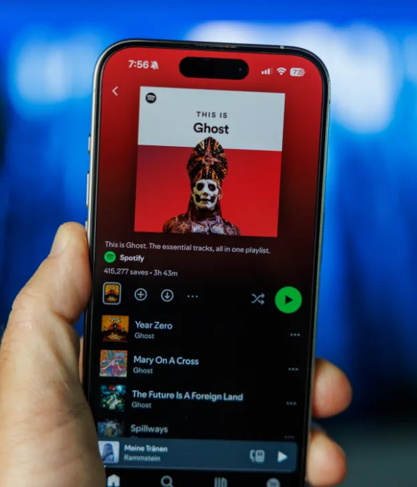 Close-up of a Spotify playlist on a smartphone screen, representing how buying Spotify album plays can increase saves and reach.